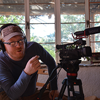 Rosdail asking an interview question in the home of a Gila resident. Photo Credits: Mary Harner